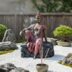 Unique Resting Buddha Statue - Pink/Red Robe Relaxing Gautam Buddha Idol on Rock Base for Home Decor, Garden, & Artistic Showpiece - Image 3